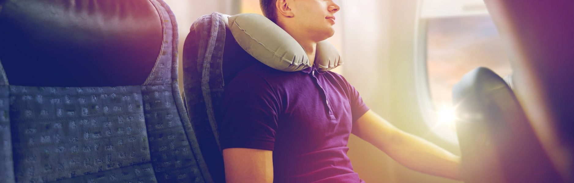 South East Chiropractic: person on plane with travel pillow
