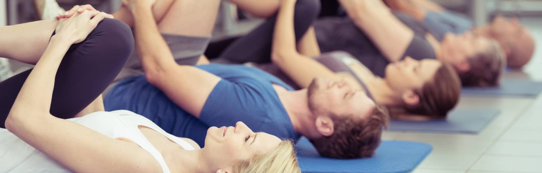 South East Chiropractic: peopel doign rehabilitation exercises on yoga mats