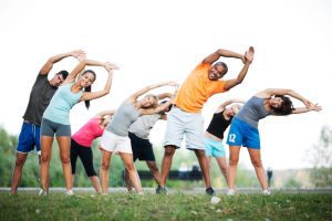 Group of people stretching together.